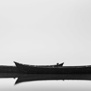 Black Boats - Classic Minimalistic Black and White Long Exposure Photograph in Limited Edition Pigment Prints on Canvas and Matte Papers by Minhajul Haque